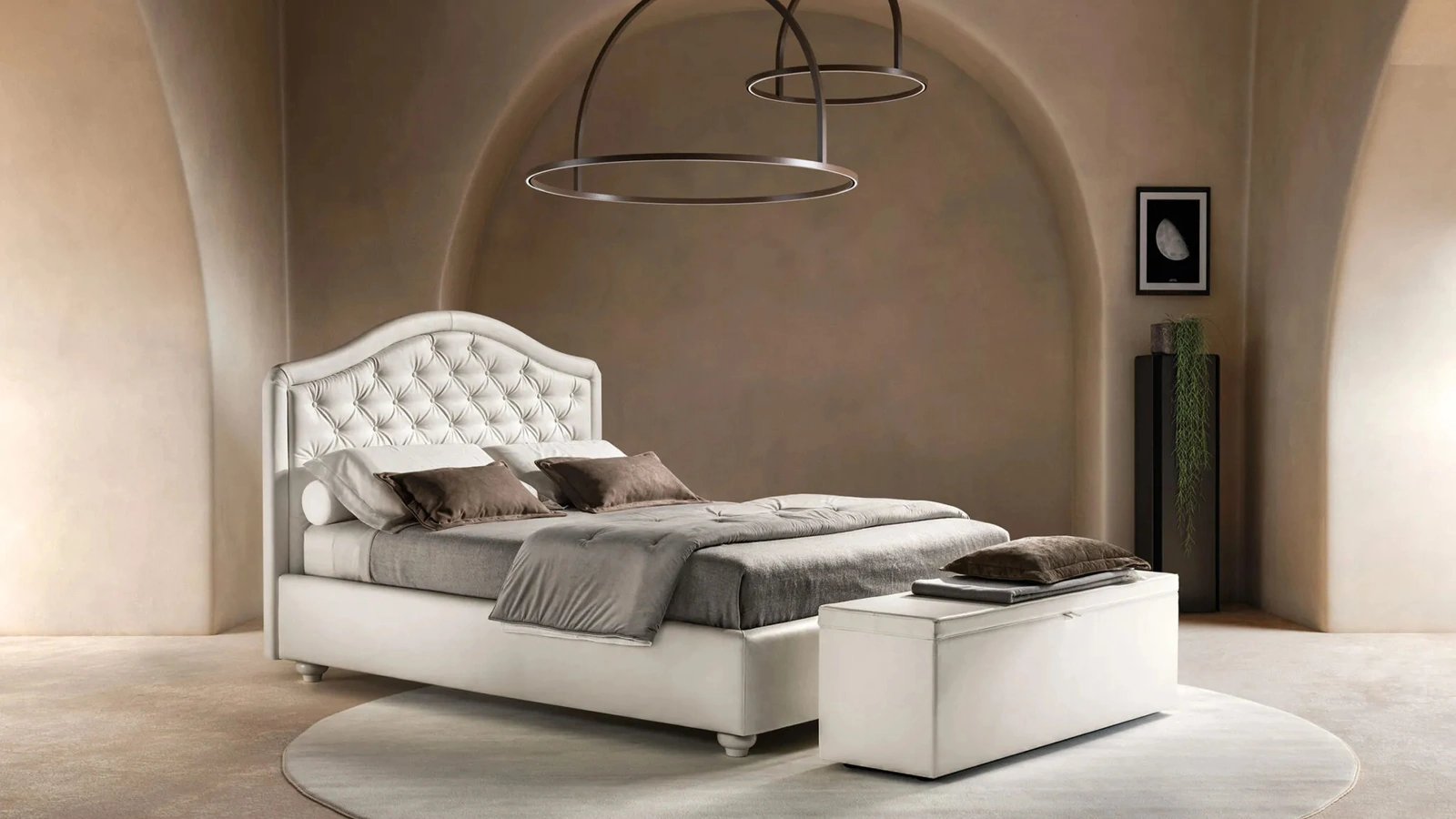 Letto in ecopelle con testiera sagomata e trapuntata Infinity di Bside