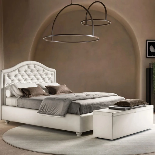 Letto in ecopelle con testiera sagomata e trapuntata Infinity di Bside