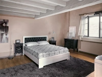 Letto in legno con testiera in pelle trapuntata Desiree di Tonin Casa