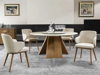 Tavolo rotondo con piano in ceramica e basamento in legno Icaro di Calligaris